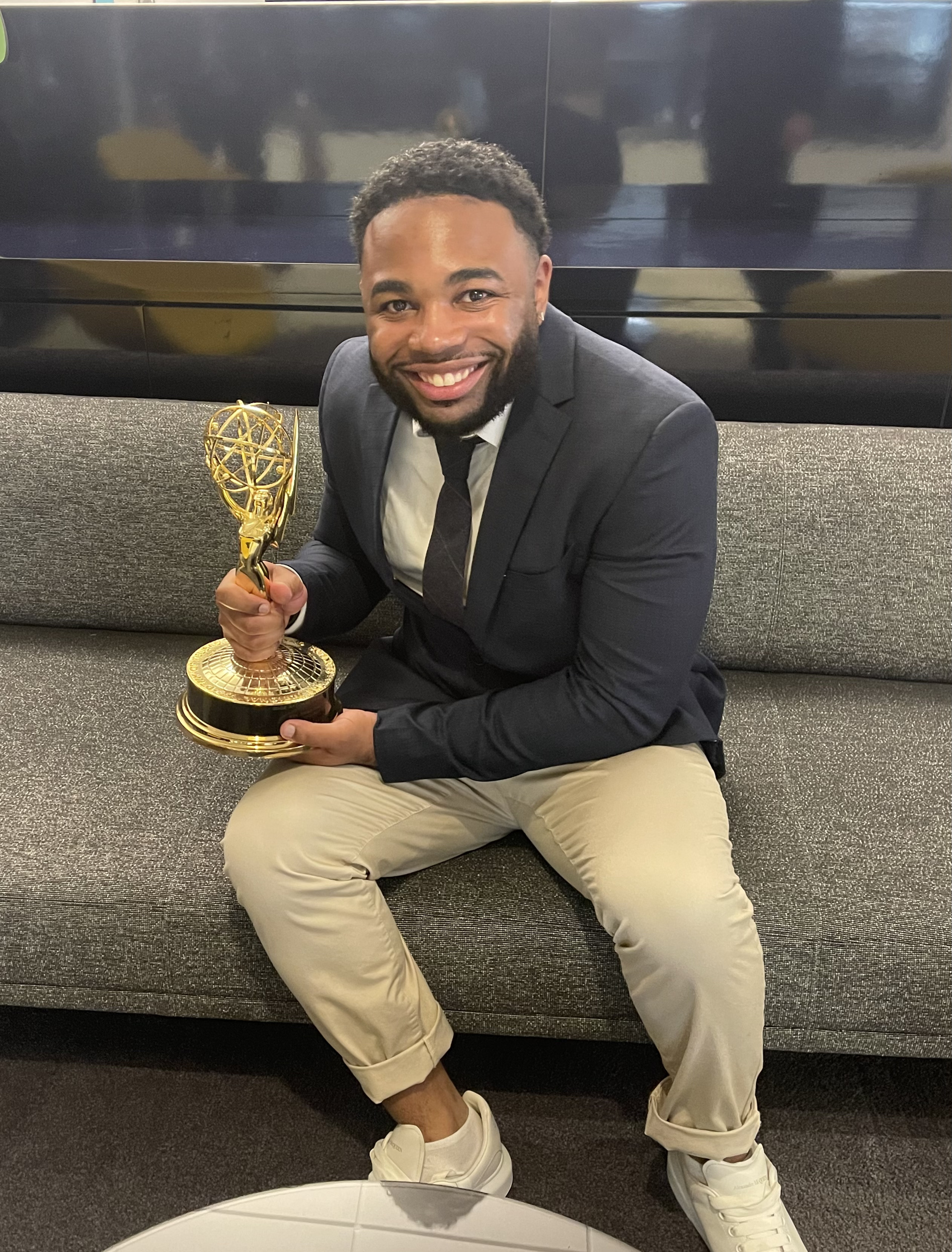 Mekhi Carter holding an Emmy Award at the Sherri studio